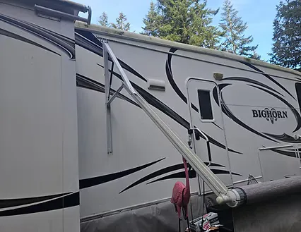 Awning arm extended on a Bighorn fifth wheel during an awning repair